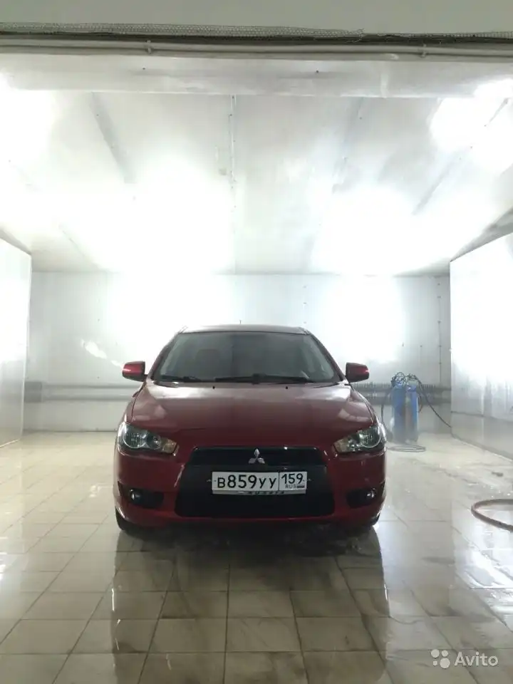 Фото автомобиля MITSUBISHI LANCER, 2008 — госномер О659УУ159. Цвет: Красный