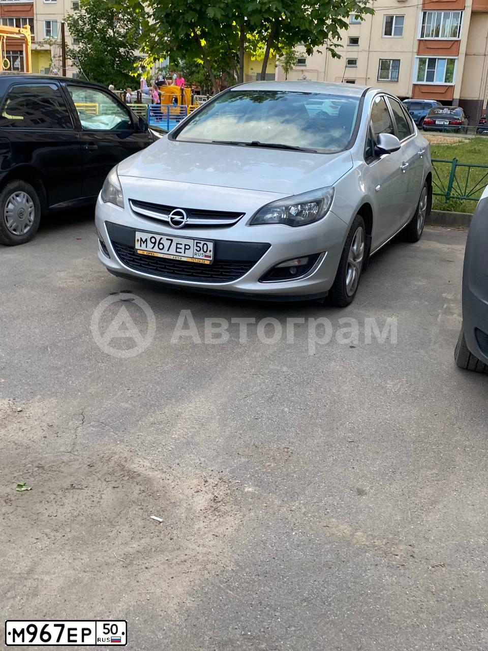 Фото автомобиля OPEL ASTRA, 2013 — госномер М967ЕР50. Цвет: СЕРЫЙ
