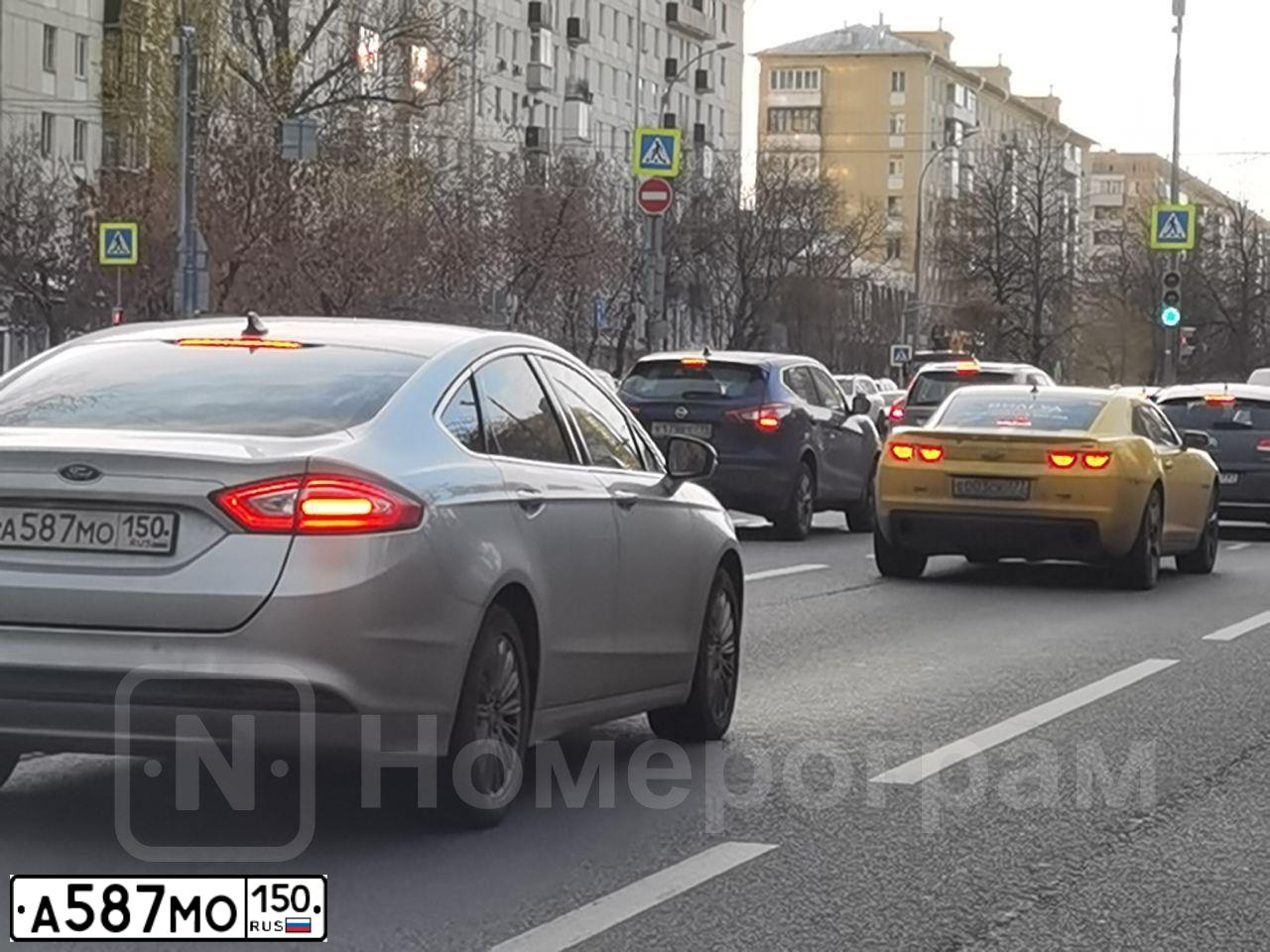 Фото автомобиля FORD FOCUS, 2011 — госномер В694МР77. Цвет: Серый