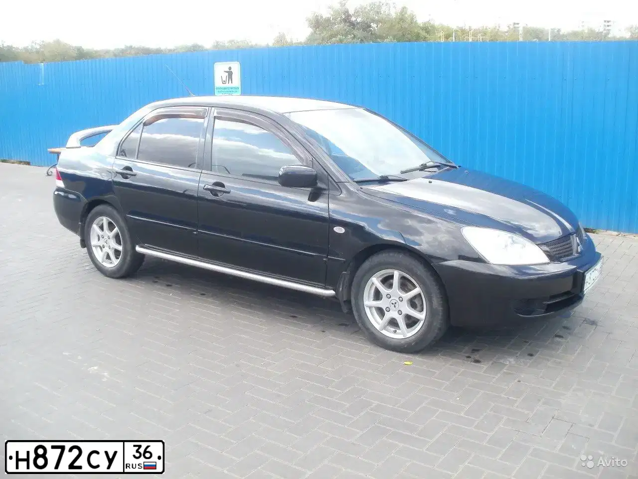 Фото автомобиля MITSUBISHI LANCER, 2006 — госномер Е981СМ36. Цвет: ЧЕРНЫЙ