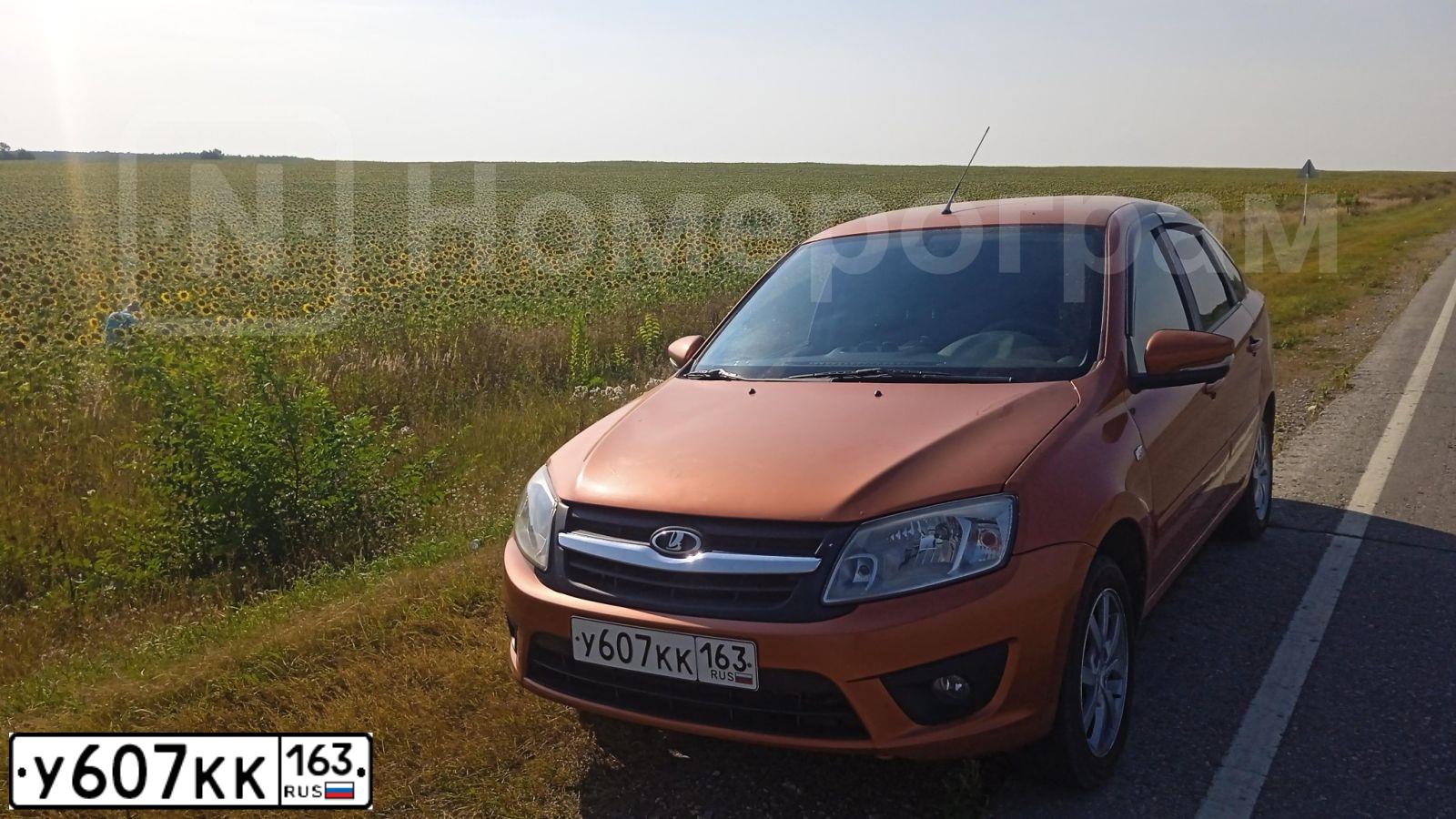 Фото автомобиля LADA GRANTA, 2014 — госномер М403РЕ126. Цвет: Оранжевый
