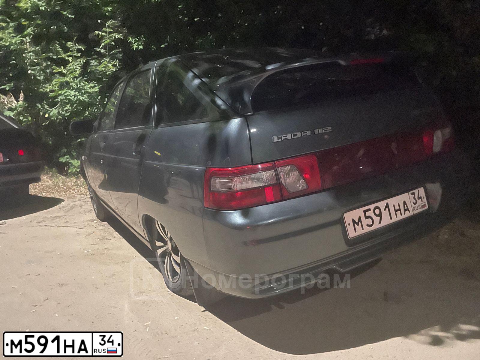 Фото автомобиля LADA 2112, 2008 — госномер М591НА34. Цвет: СИНЕ ЗЕЛЕНЫЙ