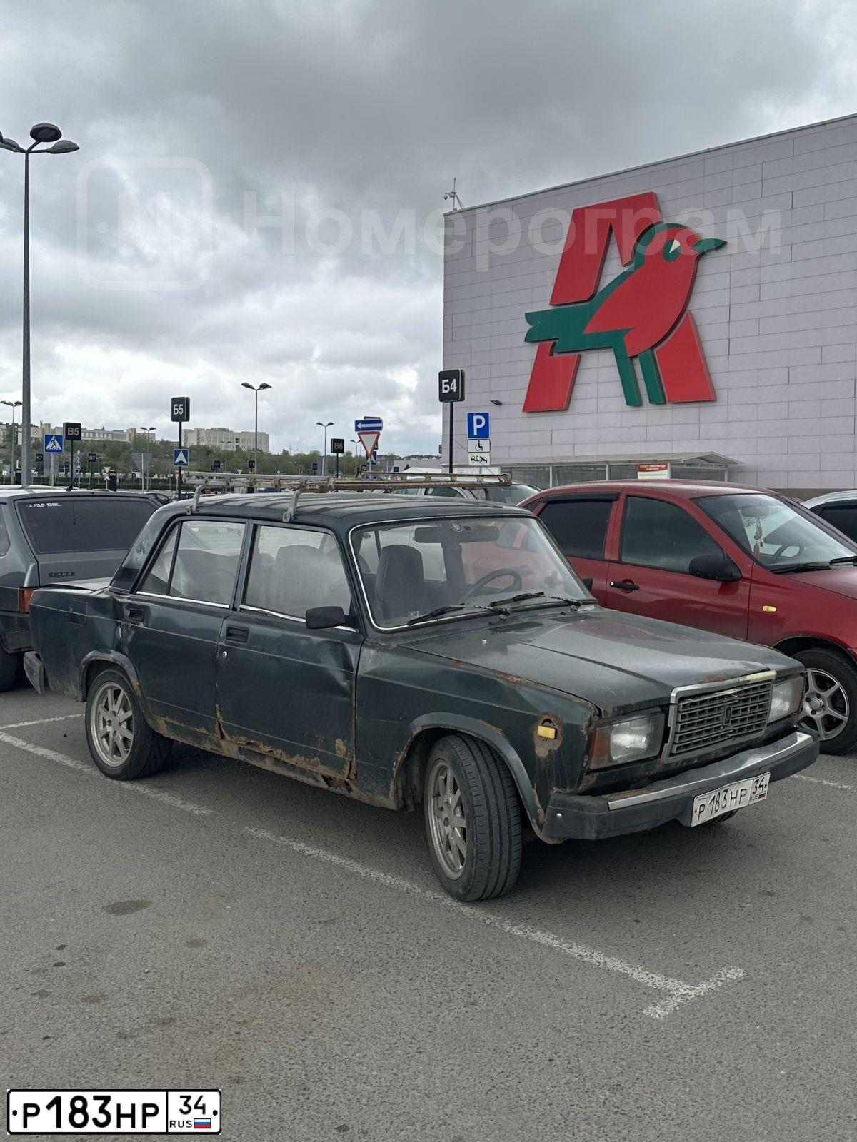 Фото автомобиля LADA 2107, 2010 — госномер Р183НР34. Цвет: СЕРО СИНЕ ЗЕЛЕНЫЙ