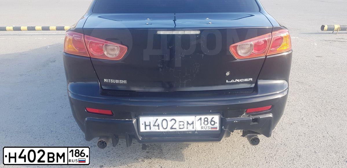 Фото автомобиля MITSUBISHI LANCER, 2008 — госномер А787ХТ86. Цвет: ЧЕРНЫЙ