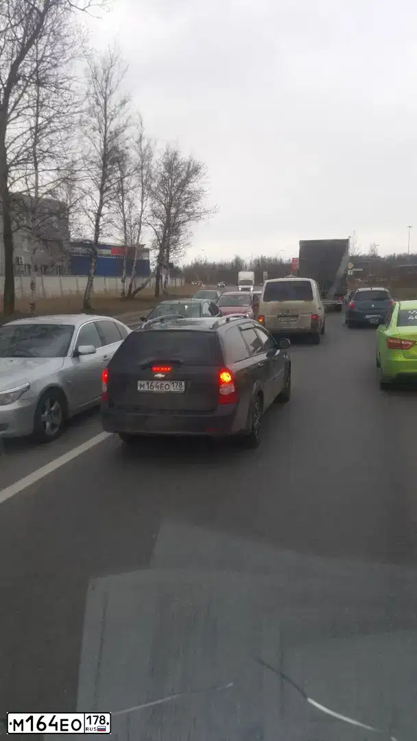 Фото автомобиля CHEVROLET LACETTI, 2011 — госномер М164ЕО178. Цвет: ЧЕРНЫЙ