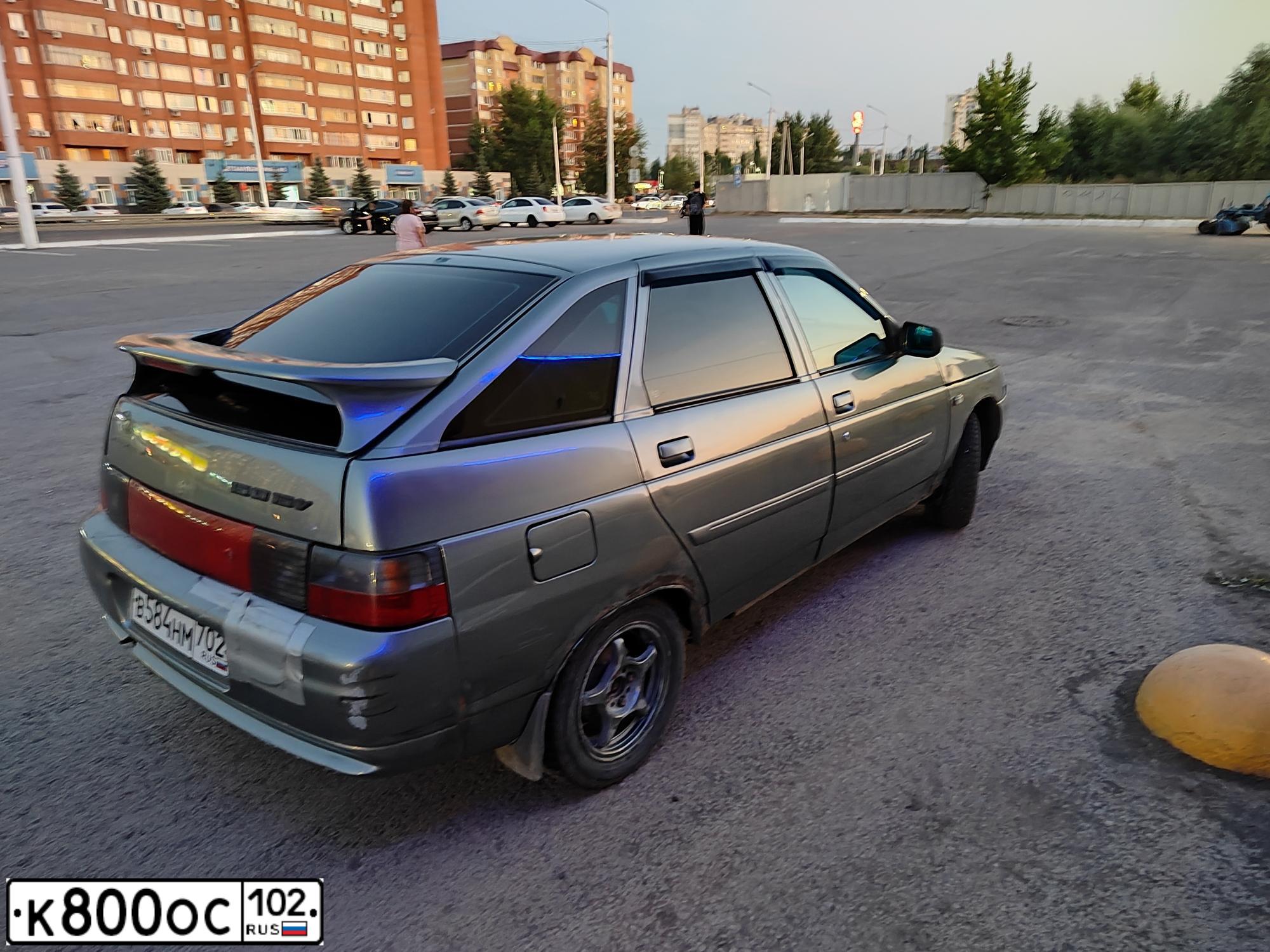 Фото автомобиля LADA 2112 LADA, 2005 — госномер К332РВ702. Цвет: Средний серо-зеленый мет.