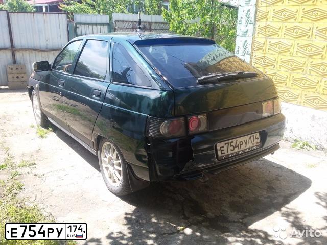 Фото автомобиля LADA 2112, 2004 — госномер Е754РУ174. Цвет: ТЕМНО-ЗЕЛЕНЫЙ