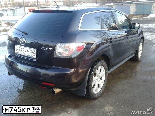 Фото автомобиля MAZDA CX-7, 2007 — госномер Р024АВ76. Цвет: ТЕМНО-ВИШНЕВЫЙ