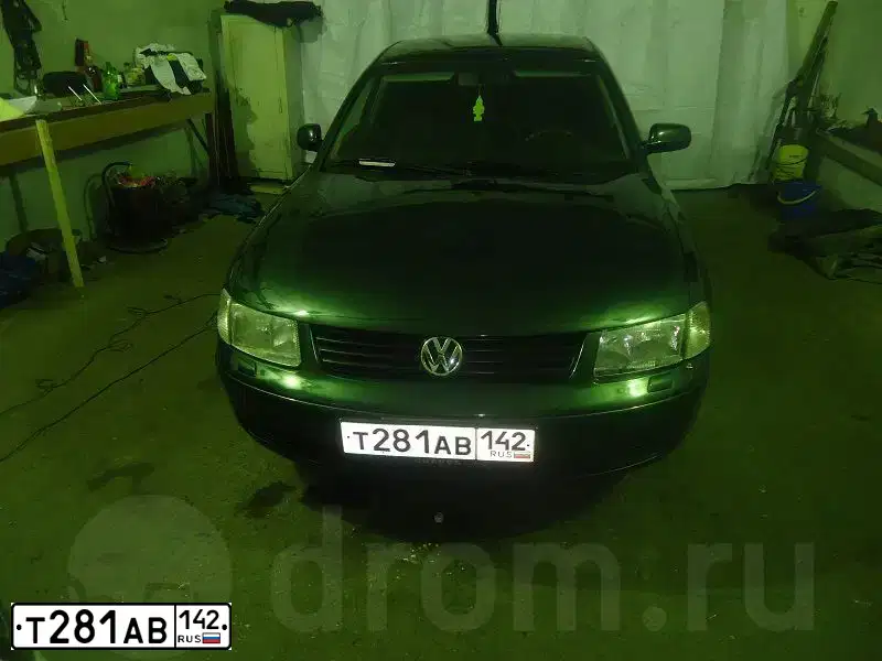 Фото автомобиля VOLKSWAGEN PASSAT, 1998 — госномер Н656СС70. Цвет: ЗЕЛЕНЫЙ