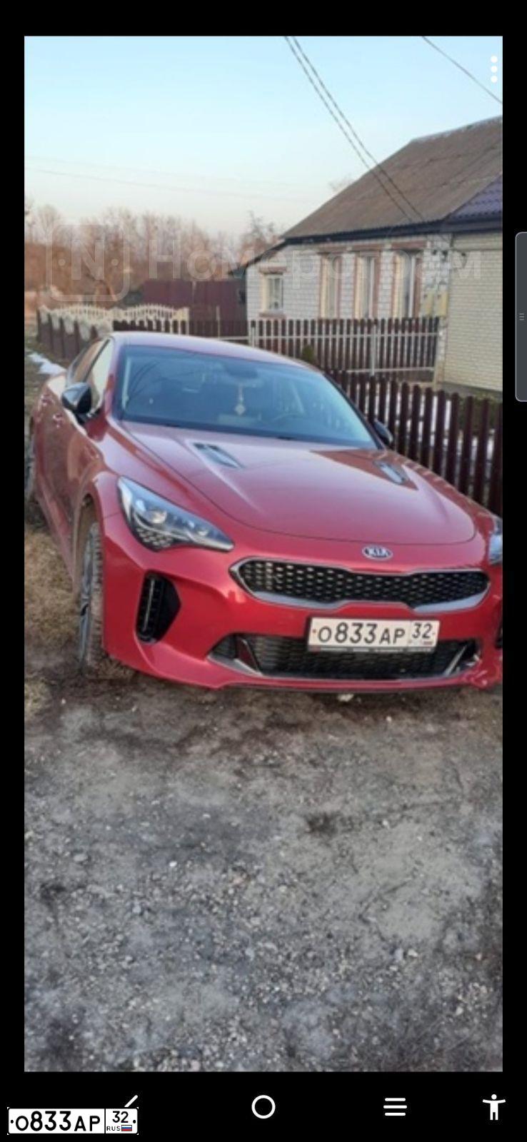 Фото автомобиля KIA STINGER, 2019 — госномер О833АР32. Цвет: Красный
