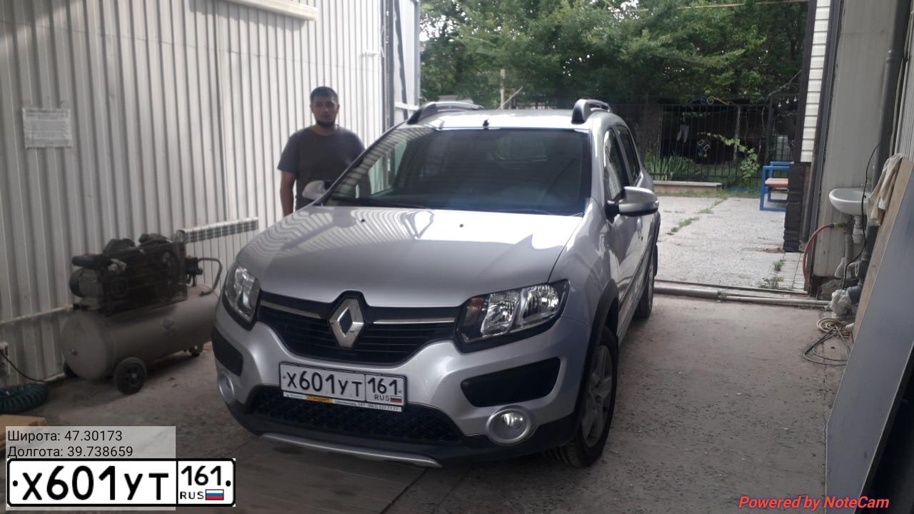 Фото автомобиля RENAULT SANDERO, 2016 — госномер Х601УТ161. Цвет: СВЕТЛО-СЕРЫЙ