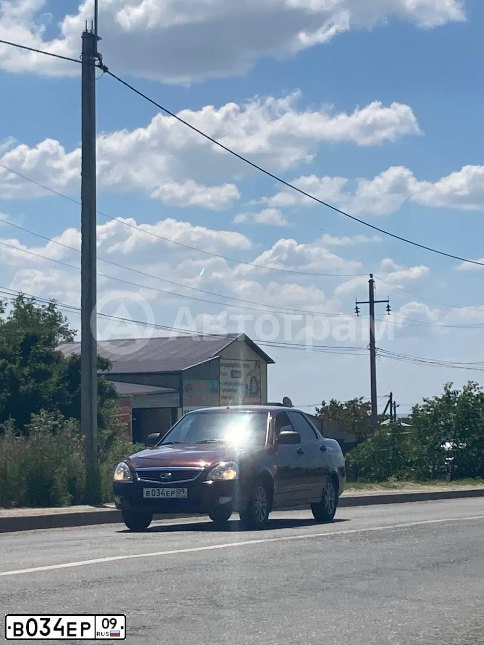 Фото автомобиля LADA 2170 PRIORA, 2013 — госномер М409ТС126. Цвет: ТЕМНО ВИШНЕВЫЙ