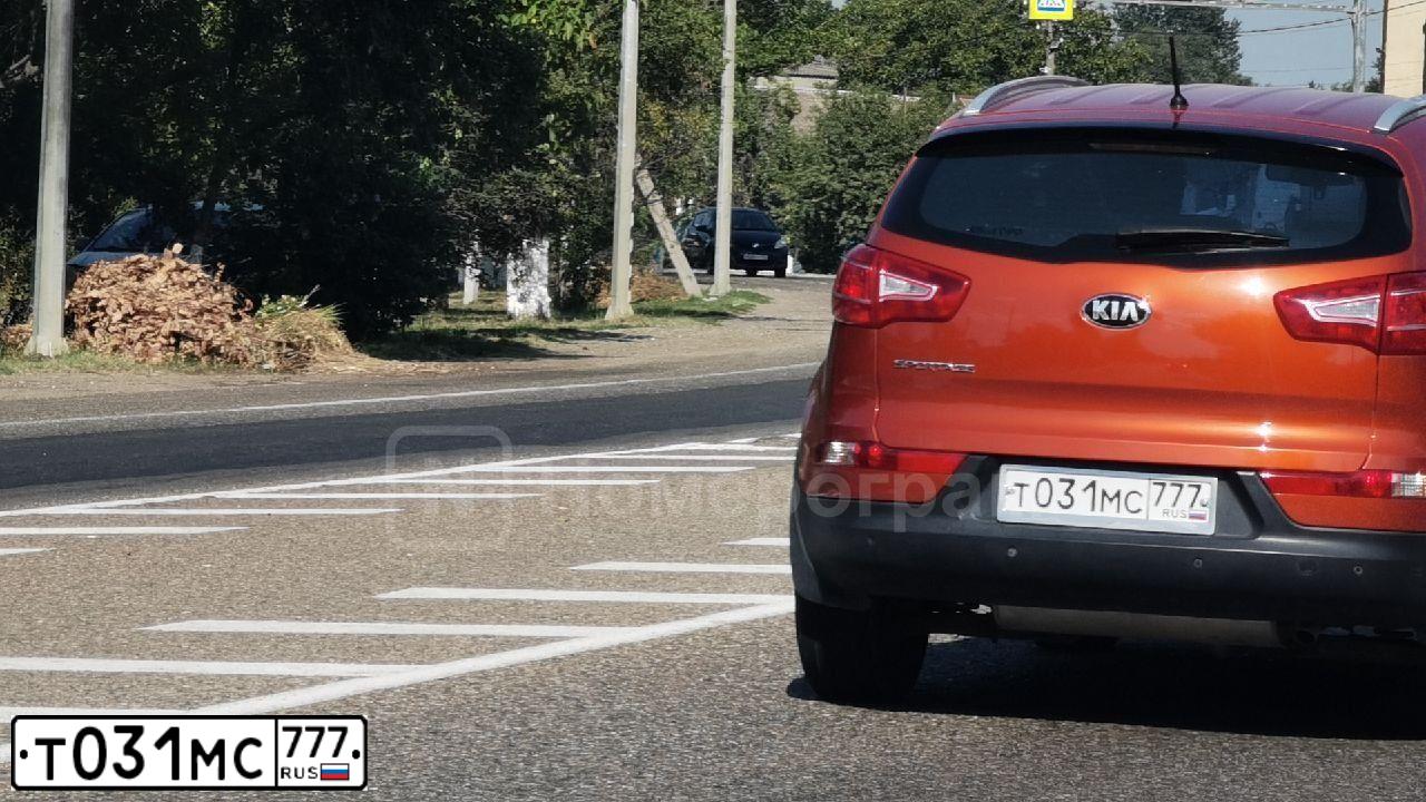 Фото автомобиля KIA SPORTAGE, 2014 — госномер Т031МС777. Цвет: ОРАНЖЕВЫЙ