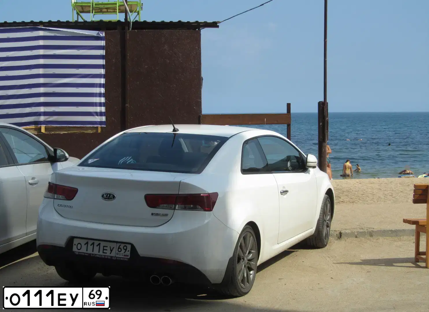 Фото автомобиля KIA CERATO, 2011 — госномер О111ЕУ69. Цвет: БЕЛЫЙ