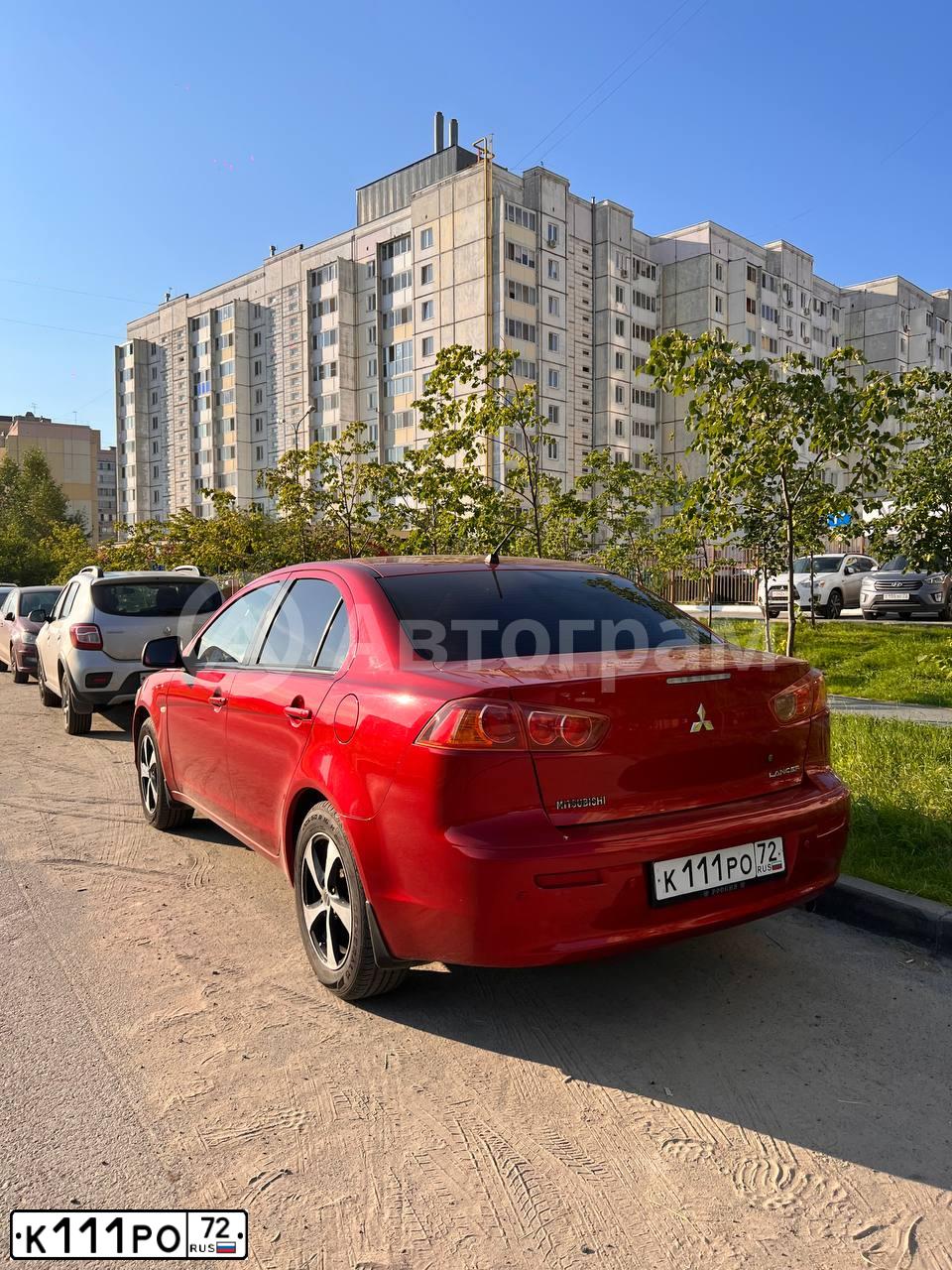 Фото автомобиля MITSUBISHI LANCER, 2008 — госномер К111РО72. Цвет: КРАСНЫЙ