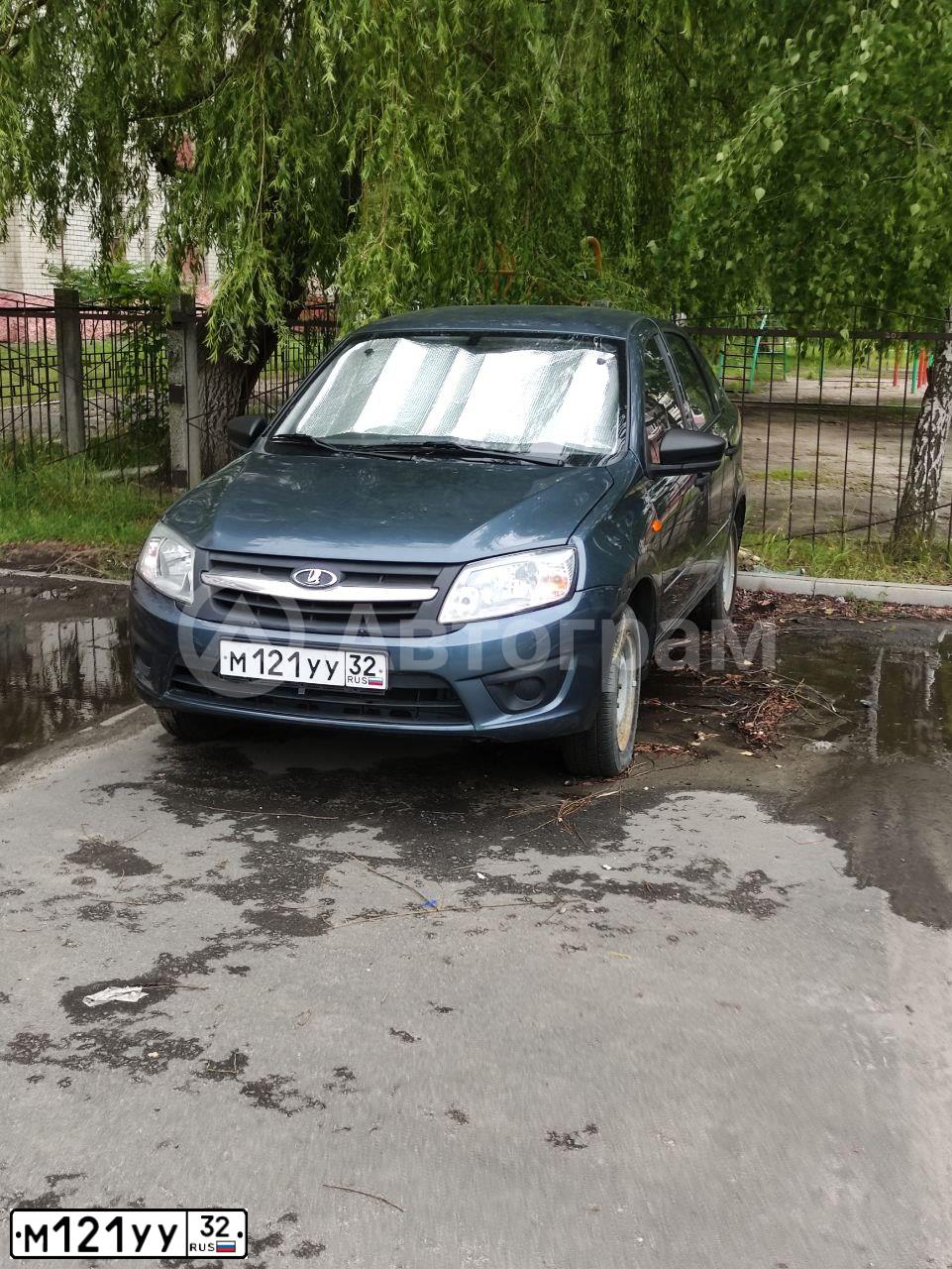 Фото автомобиля LADA 2191 GRANTA, 2015 — госномер М121УУ32. Цвет: СЕРО-СИНИЙ