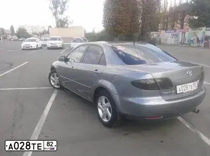 Фото автомобиля МАЗДА 6, 2002 — госномер А028ТЕ82. Цвет: Серый