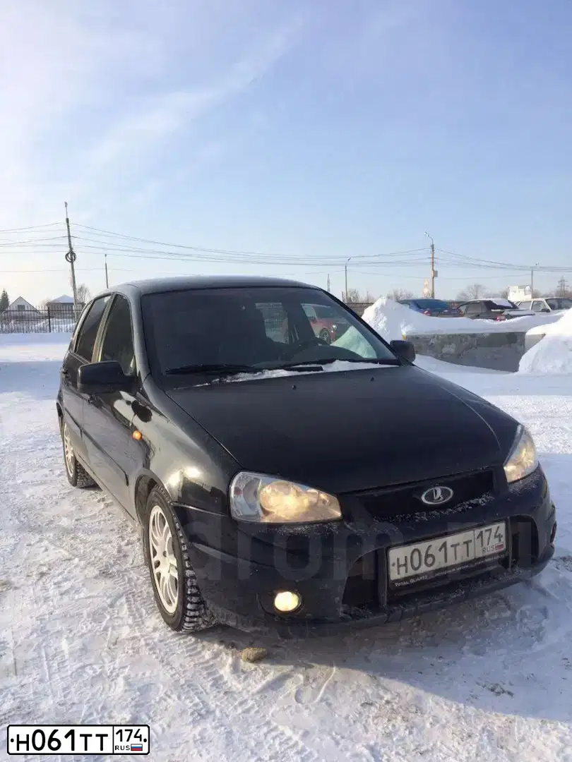 Фото автомобиля LADA 1119 KALINA, 2010 — госномер Н061ТТ174. Цвет: ЧЕРНЫЙ