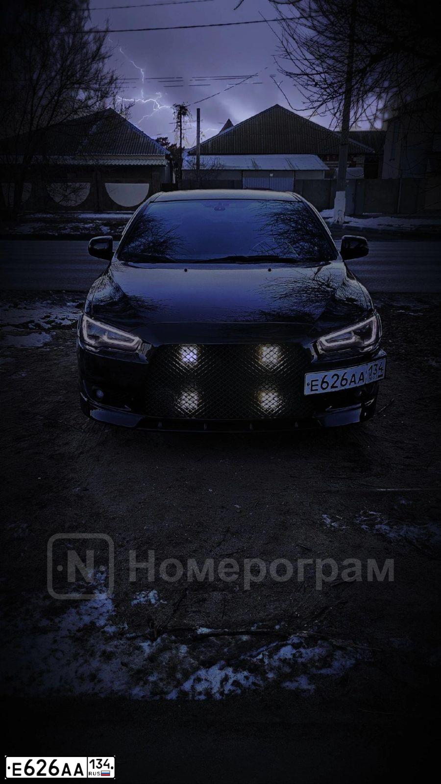 Фото автомобиля MITSUBISHI LANCER, 2008 — госномер М191ТТ34. Цвет: ЧЕРНЫЙ