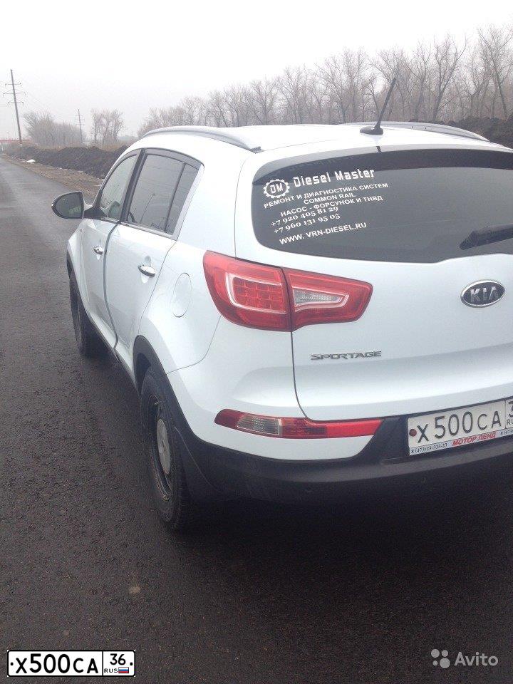 Фото автомобиля KIA SPORTAGE, 2011 — госномер Е001МА82. Цвет: Белый