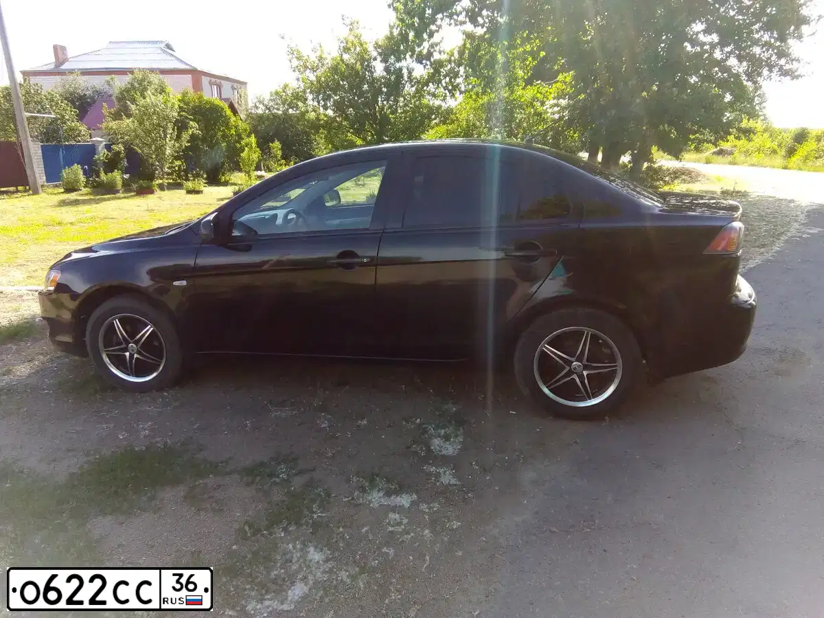 Фото автомобиля MITSUBISHI LANCER, 2010 — госномер О622СС36. Цвет: ЧЕРНЫЙ