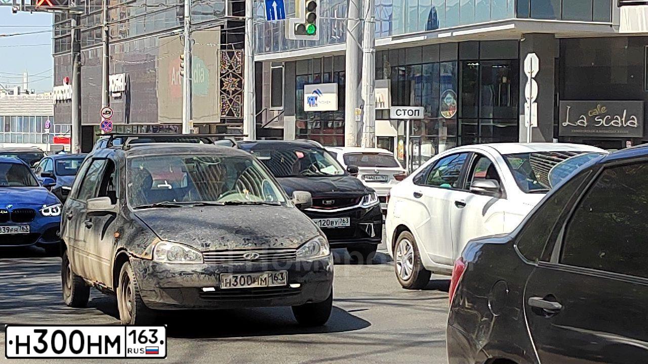 Фото автомобиля LADA KALINA, 2010 — госномер О792ВМ702. Цвет: ЧЕРНЫЙ