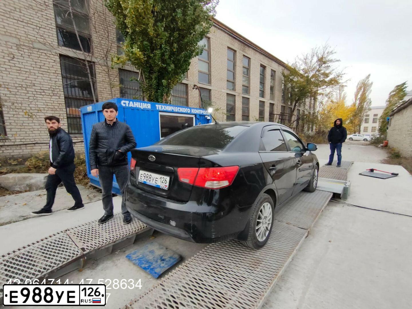 Фото автомобиля KIA CERATO, 2010 — госномер У303ЕА05. Цвет: ЧЕРНЫЙ