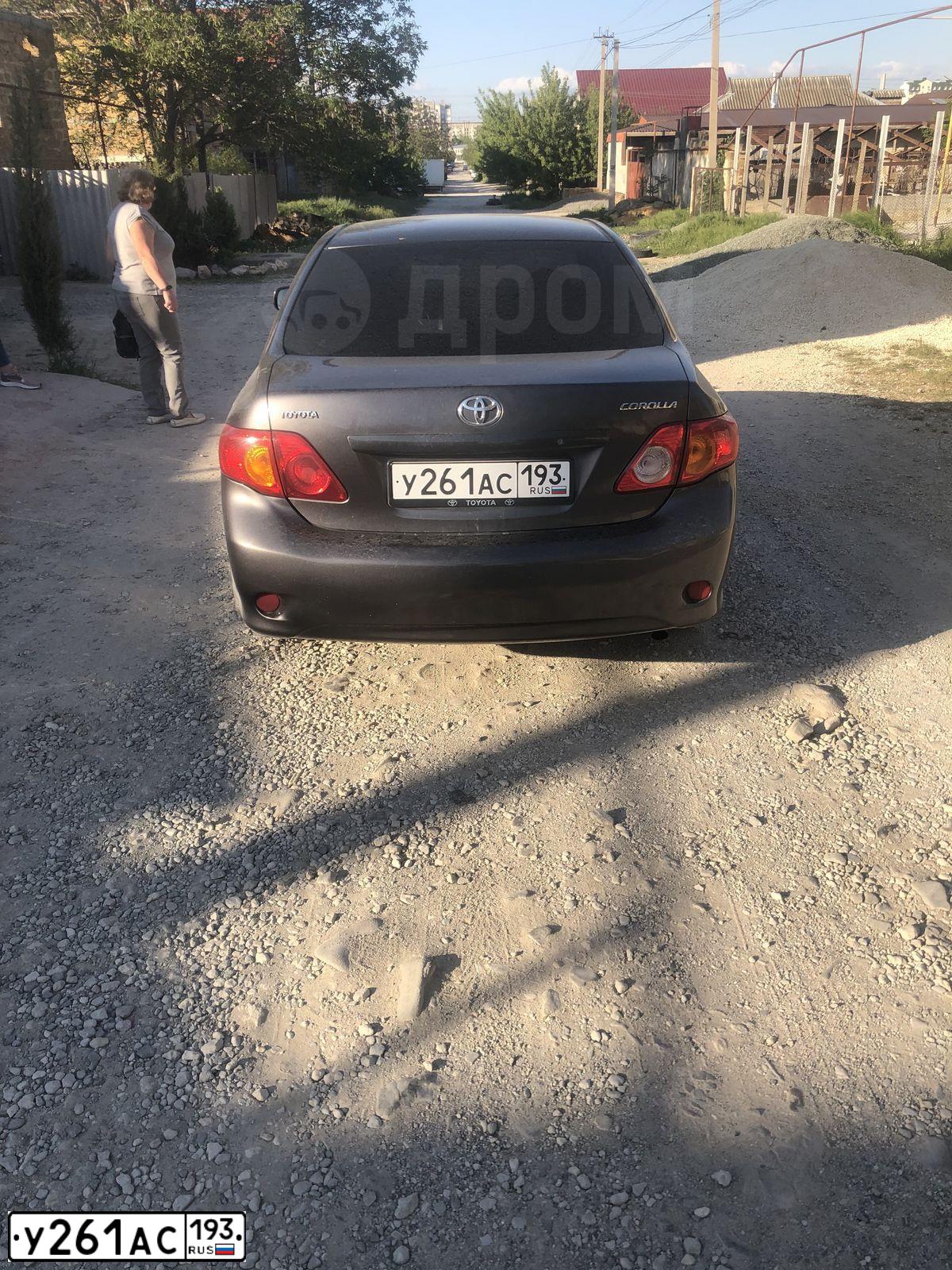 Фото автомобиля TOYOTA COROLLA, 2007 — госномер Н246АК180. Цвет: СЕРЫЙ