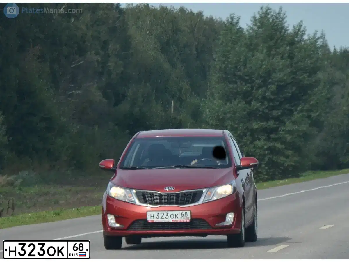Фото автомобиля KIA RIO, 2013 — госномер Н323ОК68. Цвет: КРАСНЫЙ