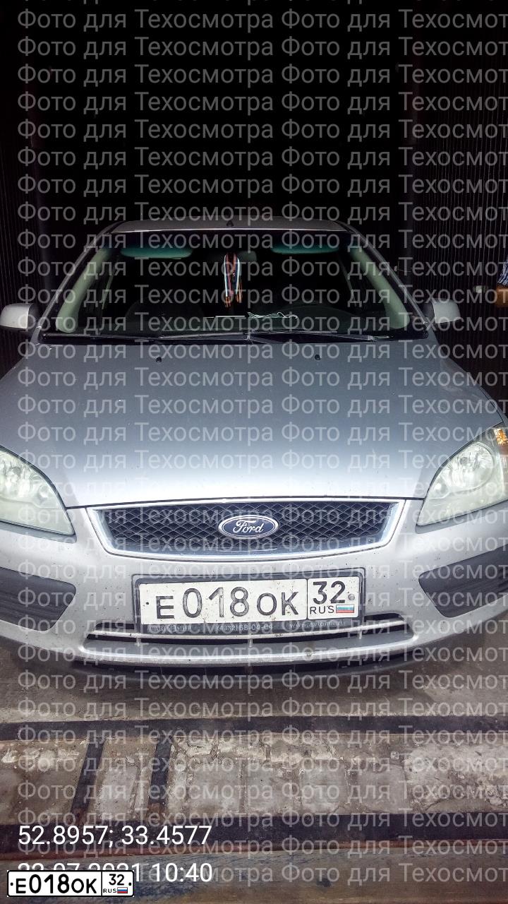 Фото автомобиля FORD FOCUS, 2006 — госномер Е018ОК32. Цвет: СЕРЕБРИСТЫЙ