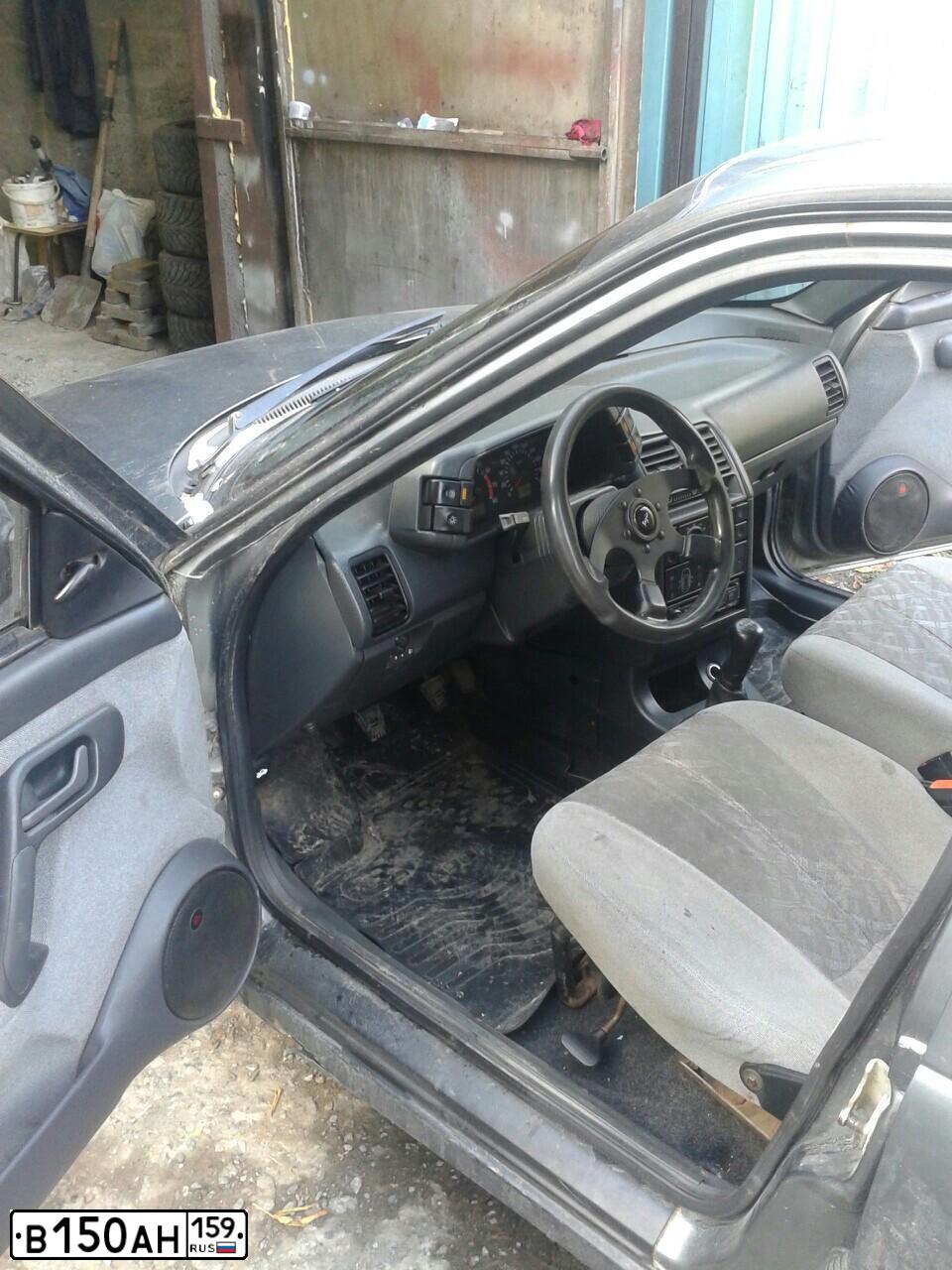 Фото автомобиля LADA 2112, 2005 — госномер В150АН159. Цвет: СРЕДНИЙ СЕРО-ЗЕЛЕНЫЙ МЕТ.