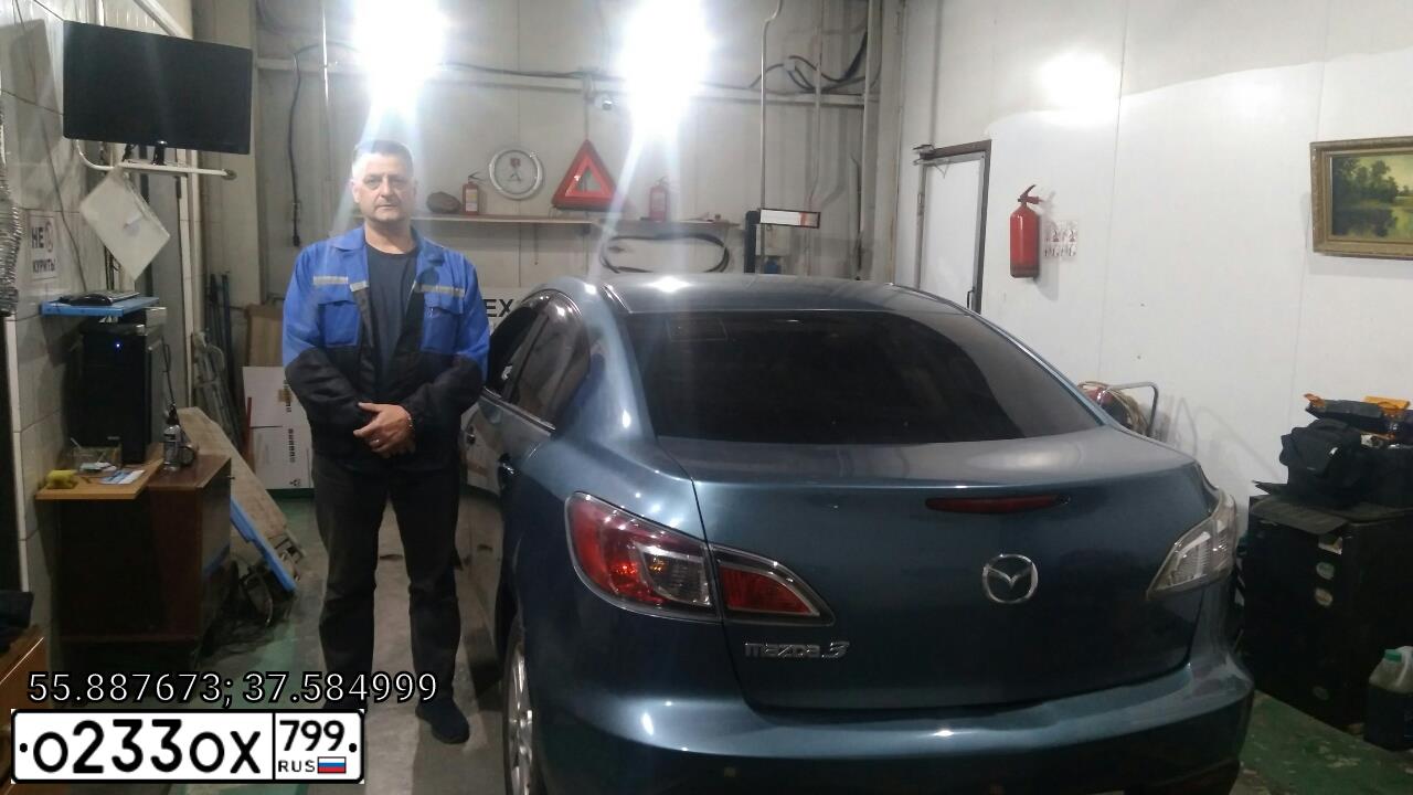 Фото автомобиля MAZDA A 3, 2011 — госномер М991МО777. Цвет: Серо-голубой
