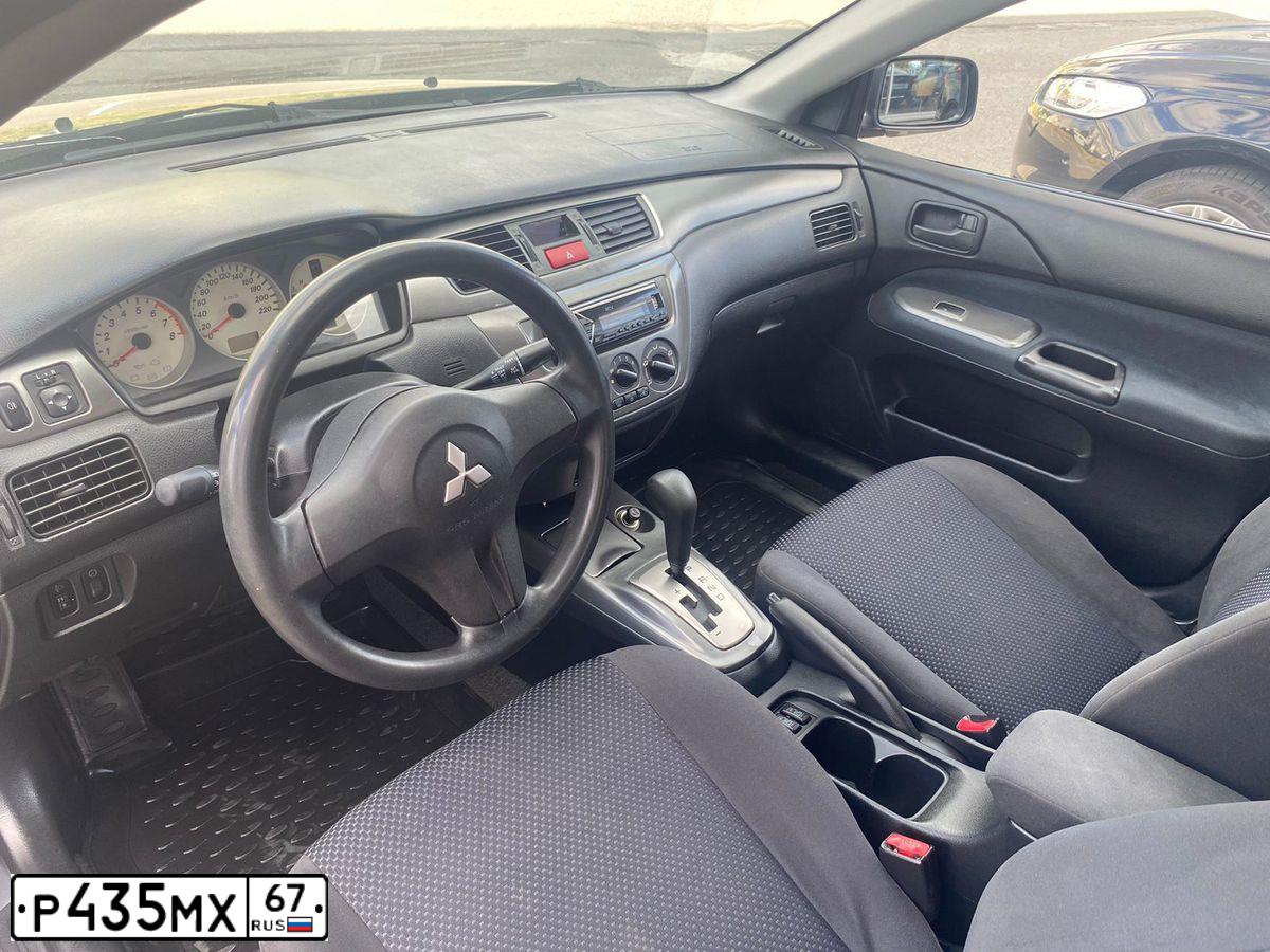 Фото автомобиля MITSUBISHI LANCER, 2005 — госномер Т123ТС797. Цвет: СЕРЫЙ