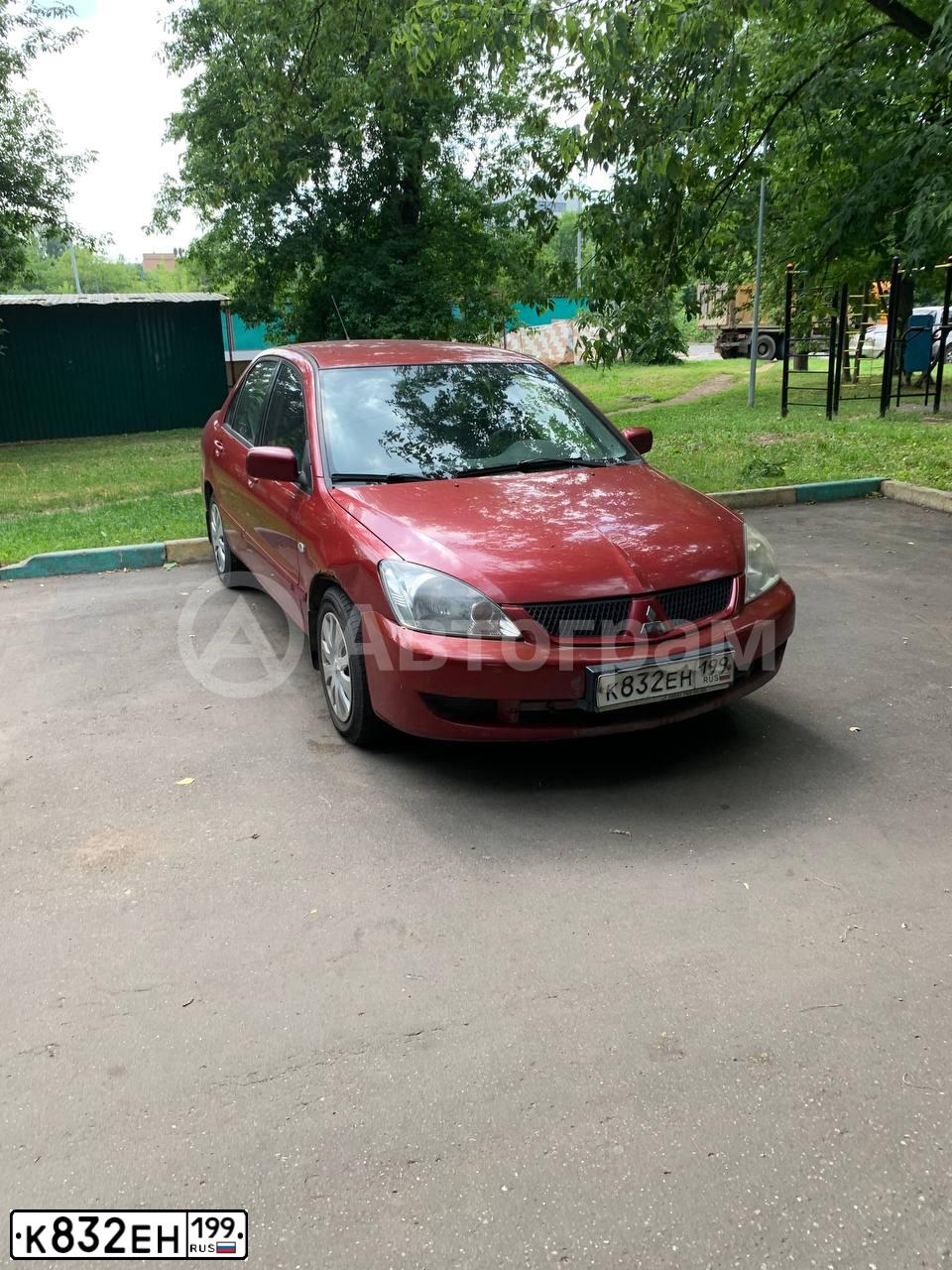 Фото автомобиля MITSUBISHI LANCER, 2006 — госномер К832ЕН199. Цвет: КРАСНЫЙ