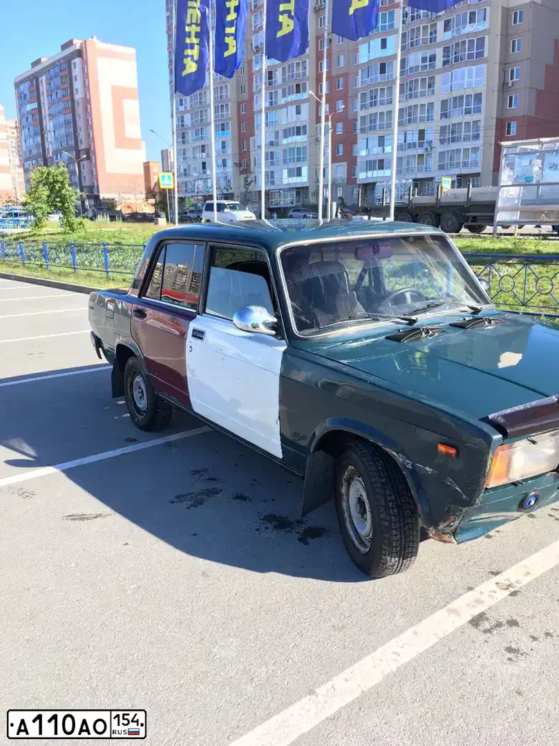 Фото автомобиля LADA 2107, 2004 — госномер А110АО54. Цвет: СИНЕ ЗЕЛЕНЫЙ