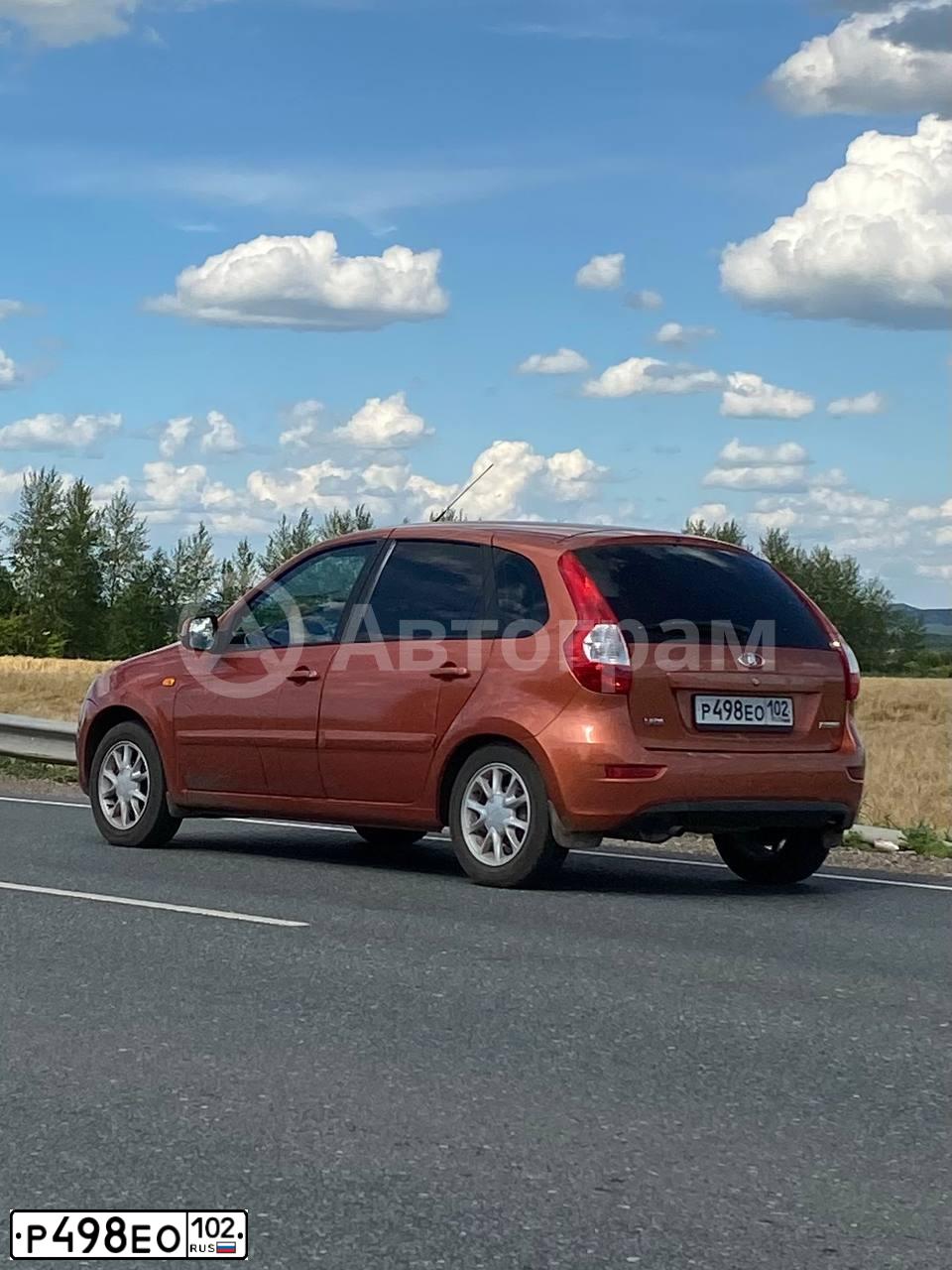 Фото автомобиля LADA 2192 KALINA, 2013 — госномер Р498ЕО102. Цвет: Оранжевый