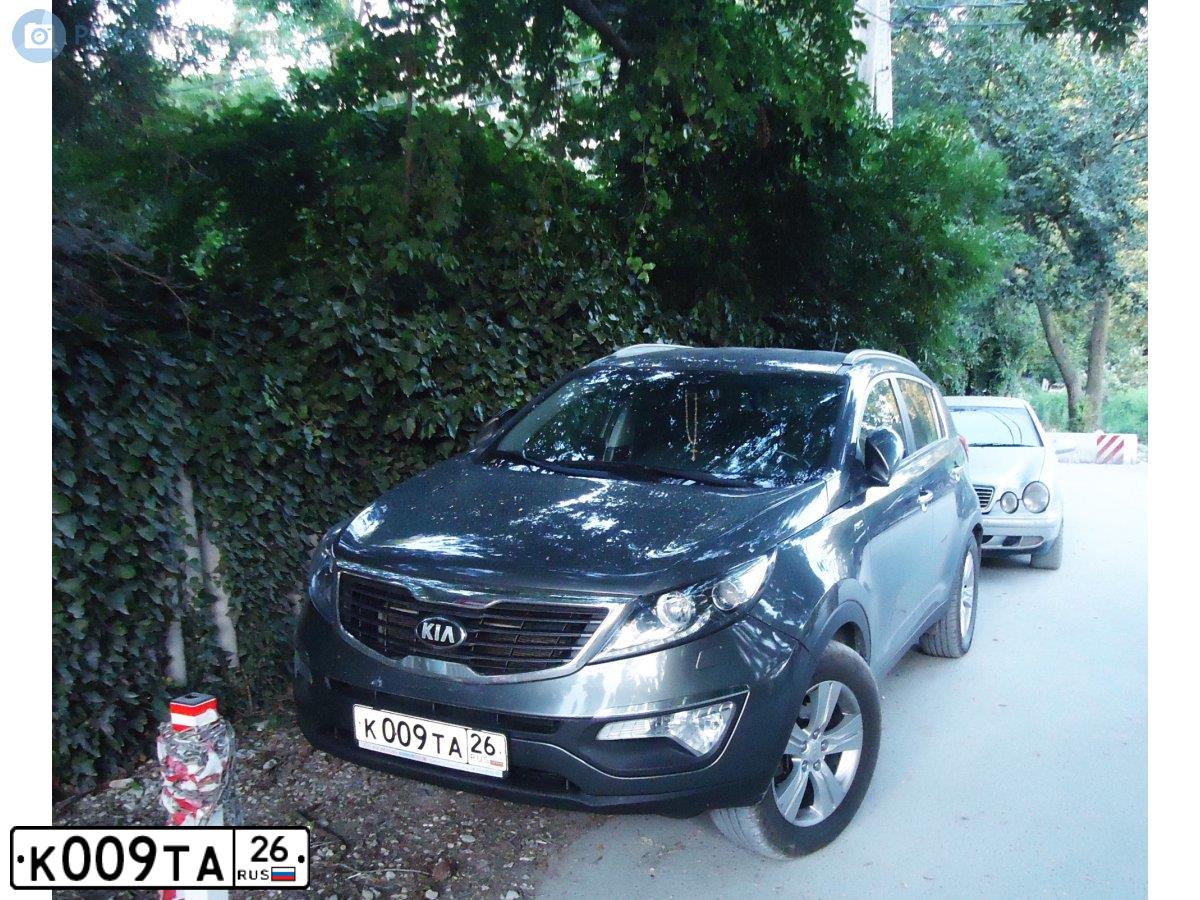 Фото автомобиля KIA SPORTAGE, 2012 — госномер К009ТА26. Цвет: СЕРЕБРИСТЫЙ