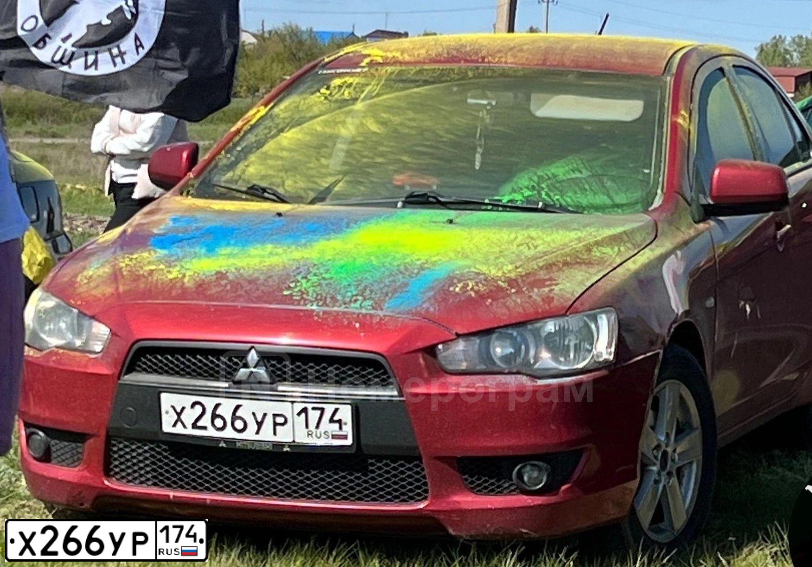 Фото автомобиля MITSUBISHI LANCER, 2008 — госномер Х266УР174. Цвет: Красный