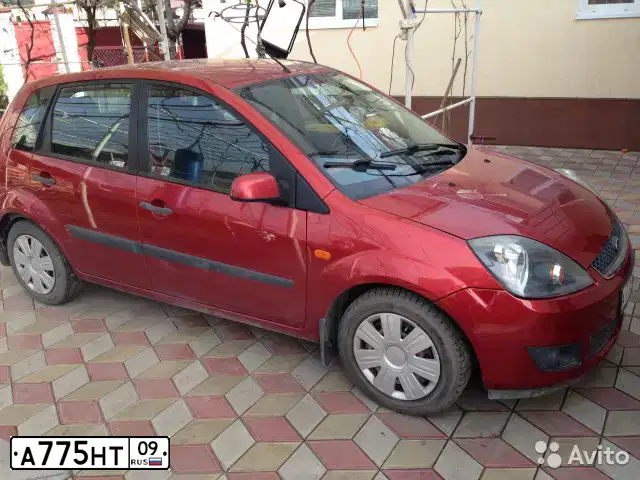 Фото автомобиля FORD FIESTA / ASPIRE, 2007 — госномер А775НТ09. Цвет: Красный