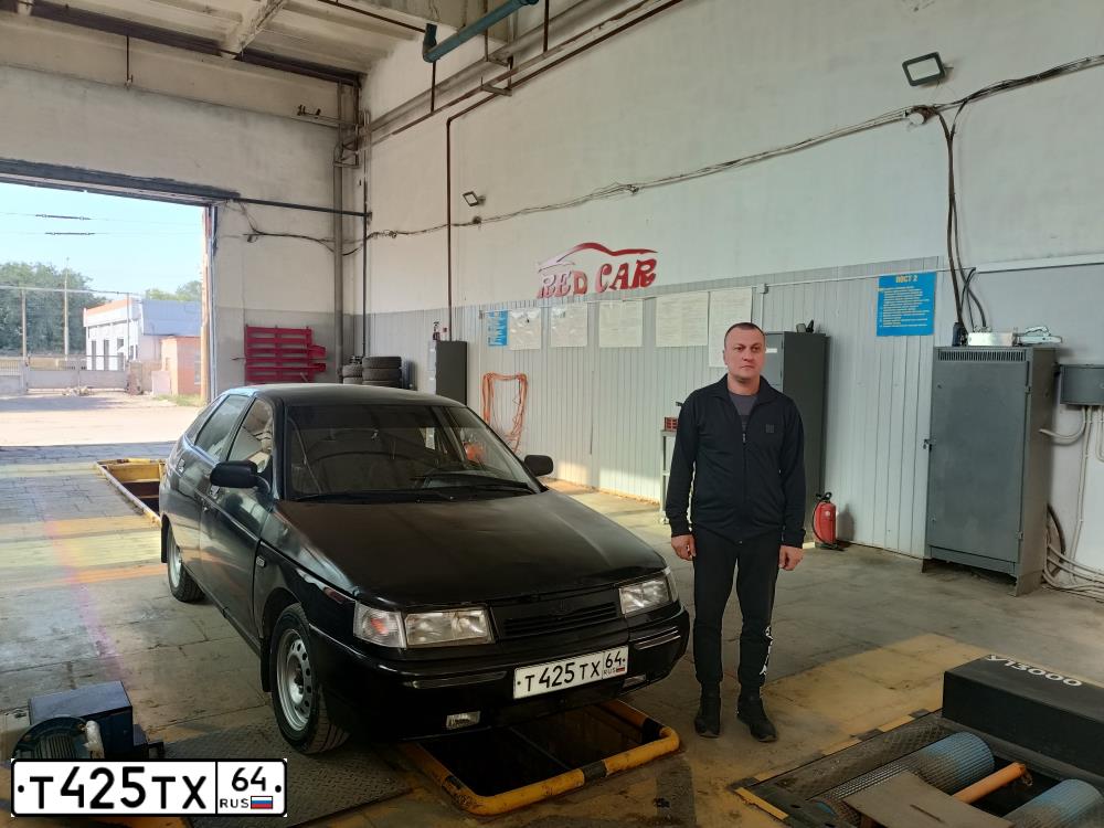 Фото автомобиля LADA 2112, 2003 — госномер Т425ТХ64. Цвет: ТЕМНО ЗЕЛЕНЫЙ