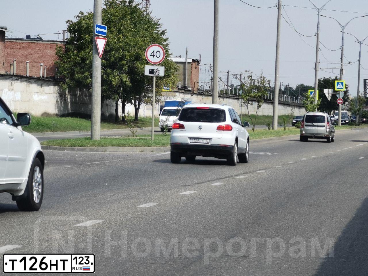 Фото автомобиля VOLKSWAGEN TIGUAN, 2014 — госномер Т126НТ123. Цвет: Белый