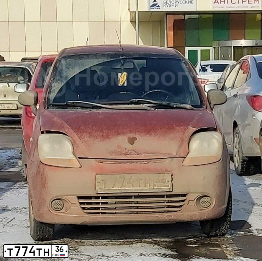 Фото автомобиля CHEVROLET SPARK, 2007 — госномер Т774ТН36. Цвет: Оранжевый