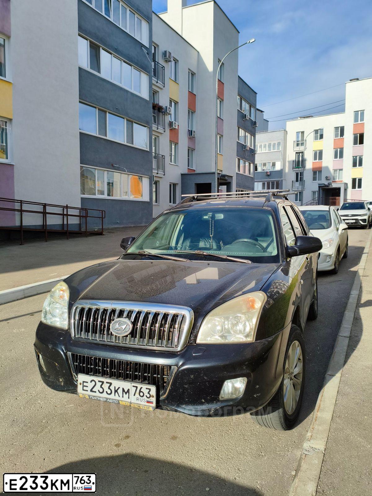 Фото автомобиля TAGAZ C190, 2012 — госномер Е233КМ763. Цвет: ЧЕРНЫЙ