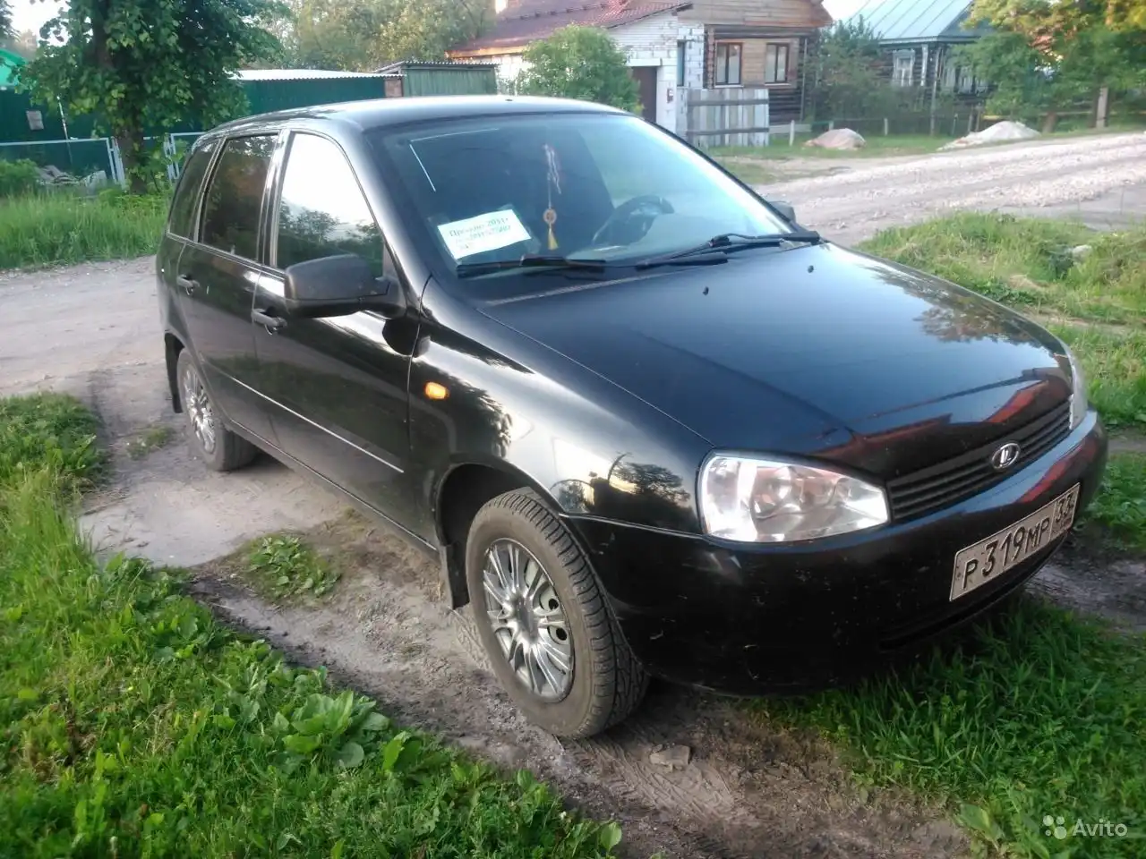 Фото автомобиля LADA 1117 KALINA, 2011 — госномер Р319МР33. Цвет: Сине-Черный