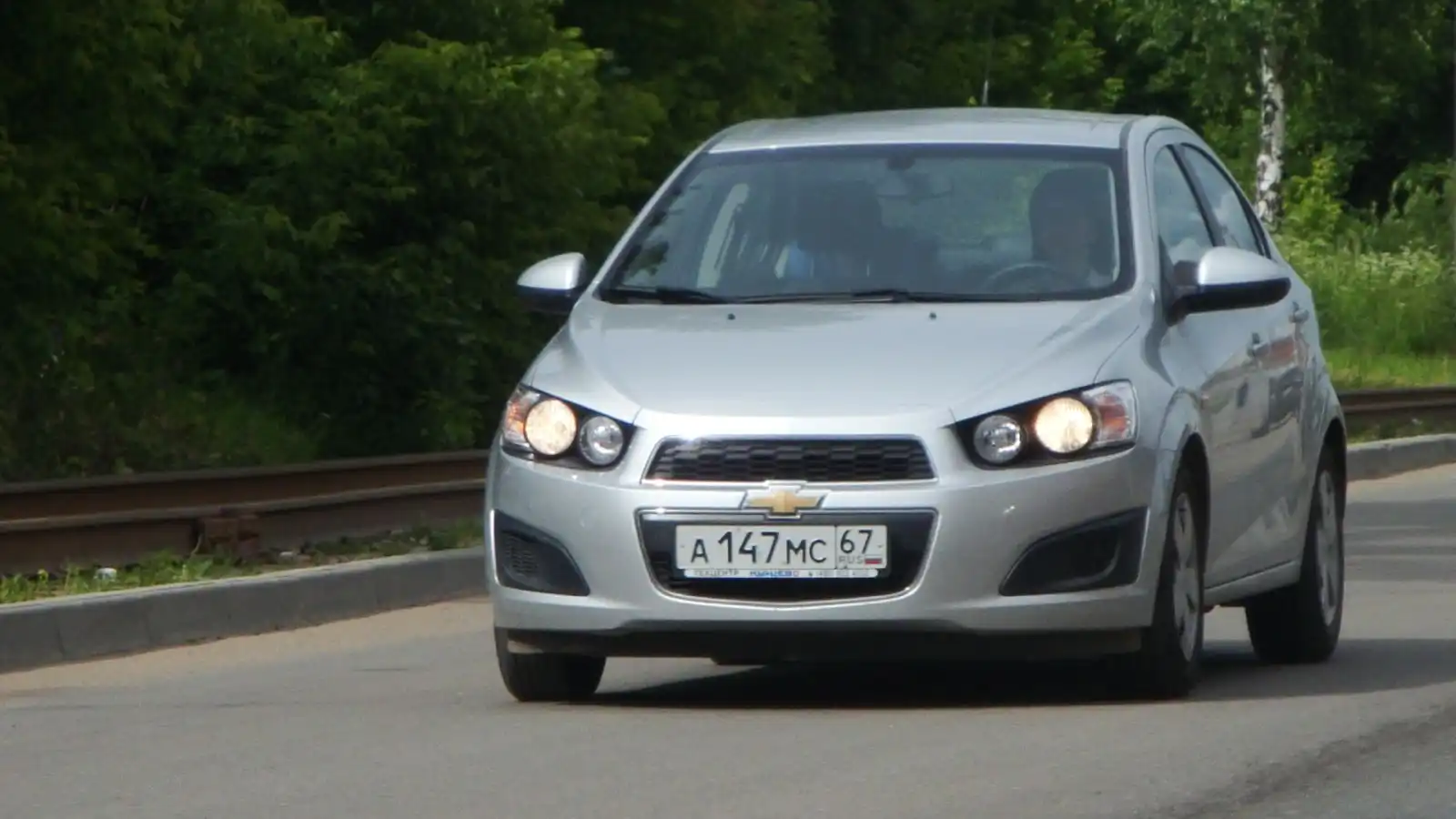 Фото автомобиля CHEVROLET T AVEO, 2012 — госномер Е116НХ67. Цвет: СЕРЕБРИСТЫЙ