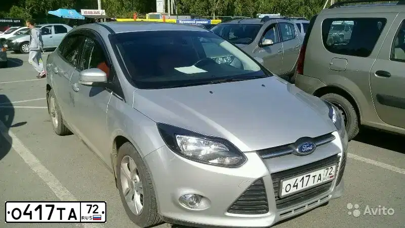 Фото автомобиля FORD FOCUS, 2012 — госномер О417ТА72. Цвет: Серебристый