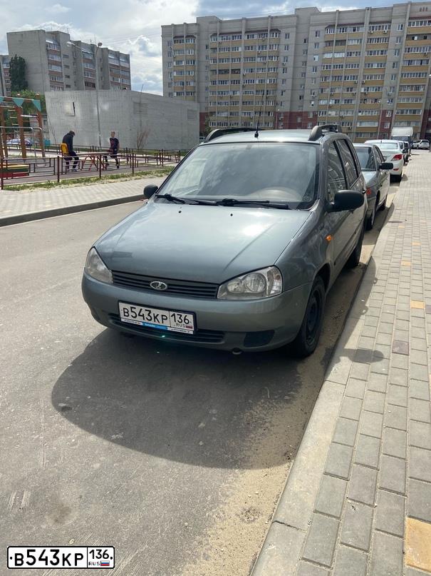 Фото автомобиля LADA 1117 KALINA, 2008 — госномер В543КР136. Цвет: Темно-серый металлик