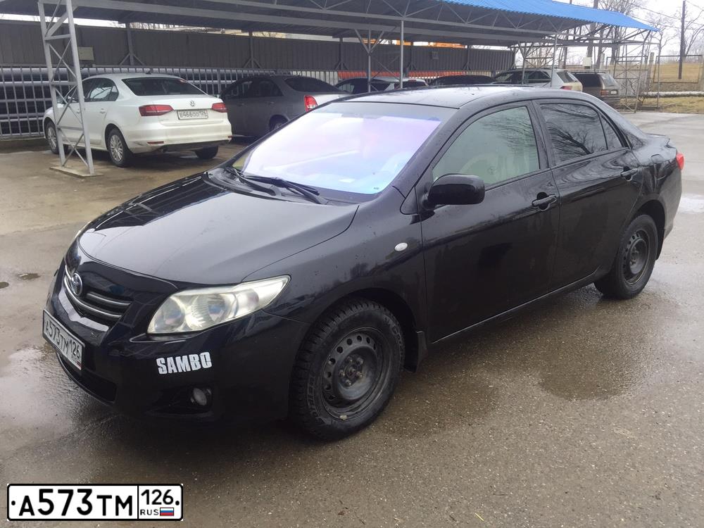 Фото автомобиля TOYOTA COROLLA, 2007 — госномер Е922ЕХ08. Цвет: ЧЕРНЫЙ
