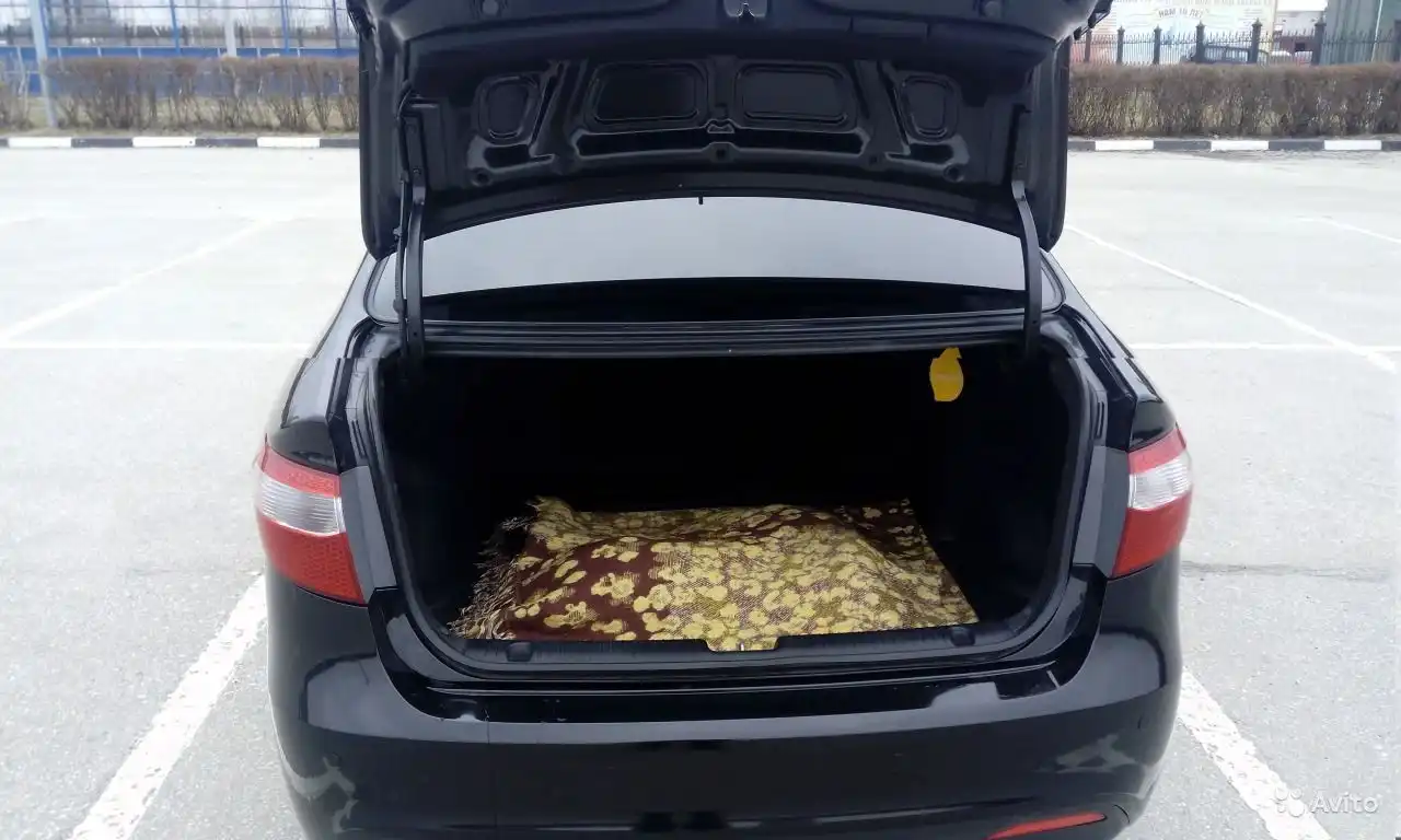 Фото автомобиля KIA RIO, 2013 — госномер Е871РХ62. Цвет: ЧЕРНЫЙ