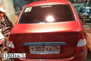 Фото автомобиля LADA 1118 KALINA, 2006 — госномер Т303ХА74. Цвет: СЕРЕБРИСТО-КРАСНЫЙ